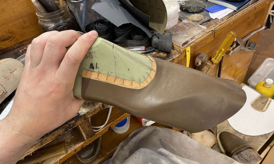 Lasting leather on last